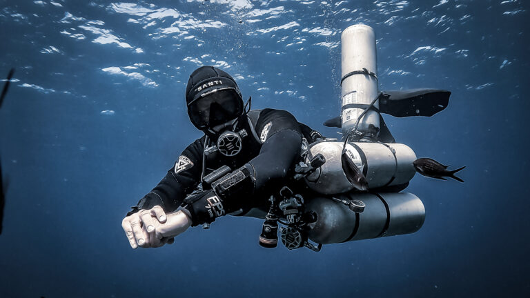 A sidemount diver with 4 cylinders. Intro to Tech Diving course in Gozo with Sidemount Society