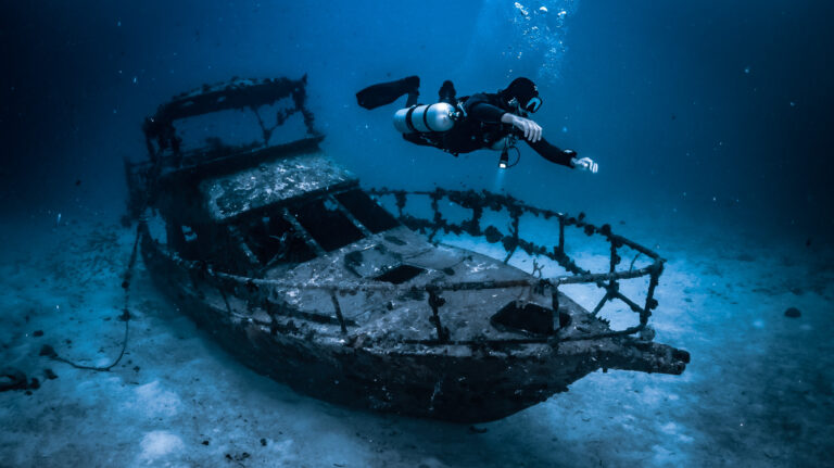 A sidemount diver diving at a wreck in Gozo (Malta) with Sidemount Society.